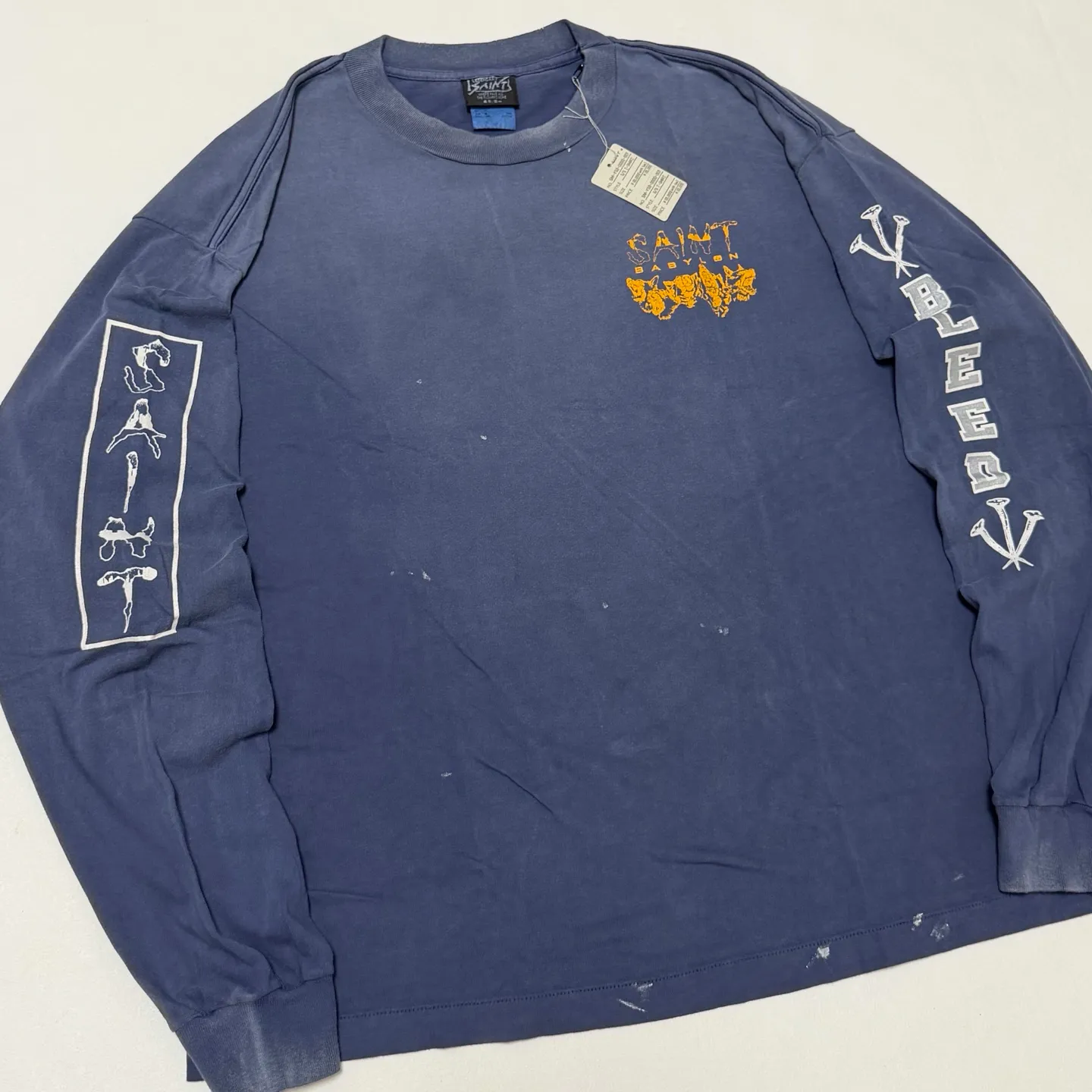 SAINT Mxxxxxx × BABYLON BBLN_LS TEE/SAINT BABYLON/NVY/BABYLON co-branded style Wolf head SAINT/nail distressed long sleeves Washed blue S-XL Completely matched Tube weaving fabric without side seams Garment dyeing Maliu water faded distressing Simulated sun fading treatment Natural fading Handmade holes and frayed Ink splashing treatment Correct main mark/wash mark/little angel anti-counterfeiting mark
